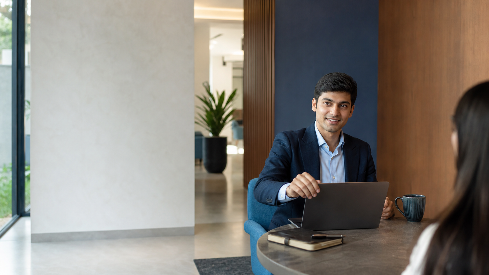 Indian consultant preparing for a client conversation in a modern Kolkata office